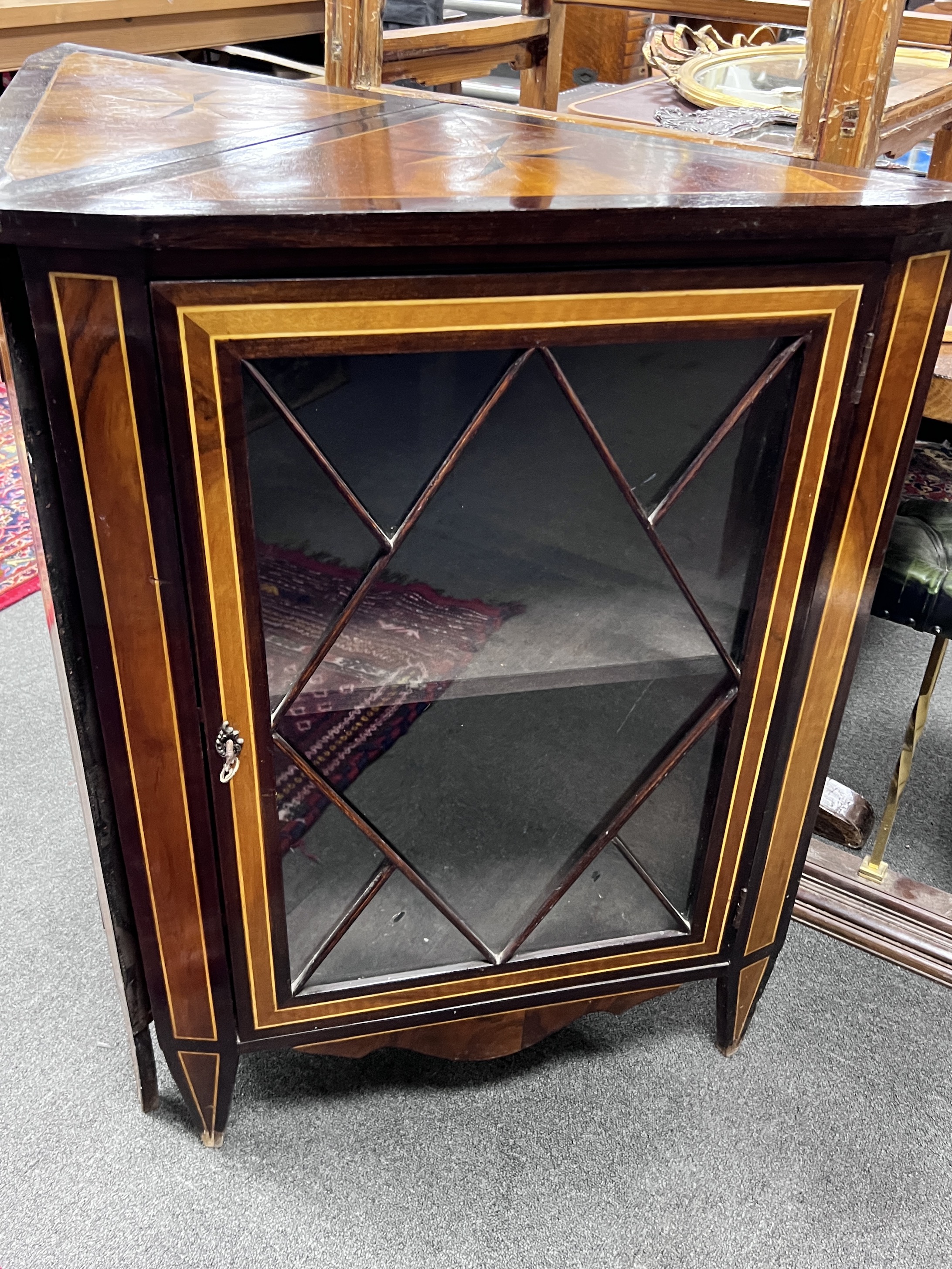 A pair of 19th century Dutch inlaid and stained beech corner cabinets, each set with a Maltese Cross to the top, width 67cm, height 92cm